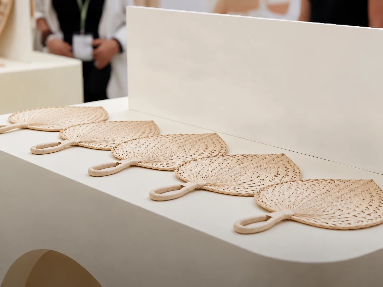 Woven fans used as corporate and brand event merchandise